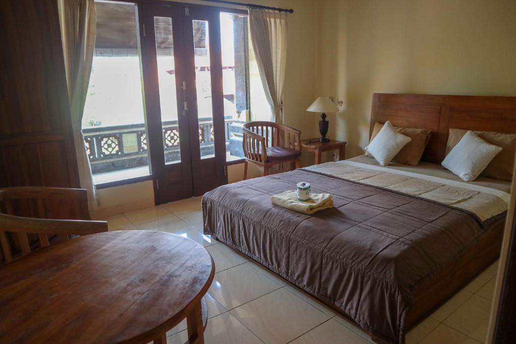 Postel nebo postele na pokoji v ubytování Ubud Canti House