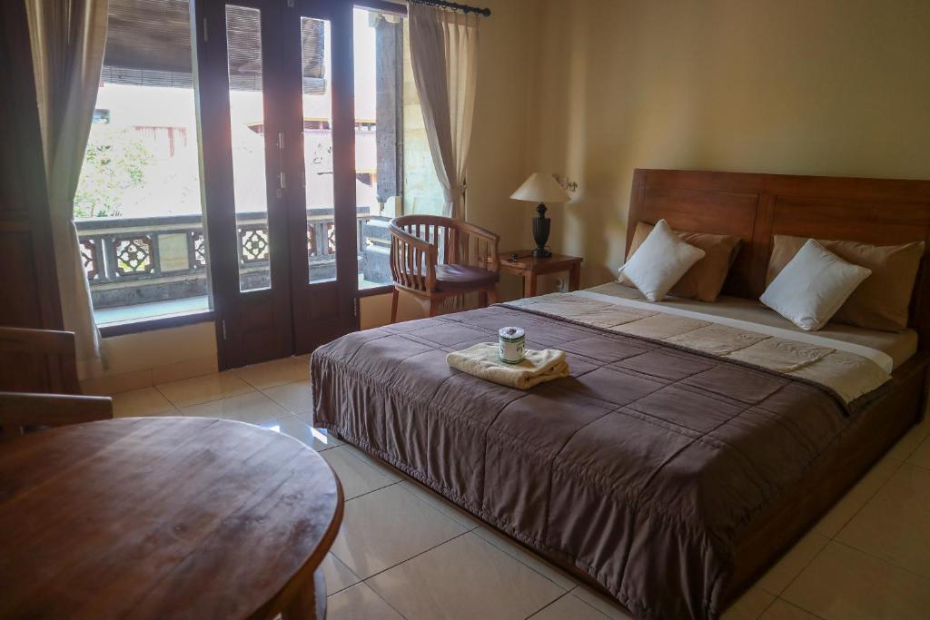 Postel nebo postele na pokoji v ubytování Ubud Canti House
