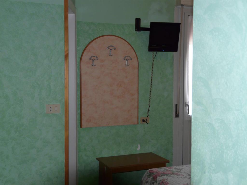TV a/nebo společenská místnost v ubytování Hotel Vecchia Rimini