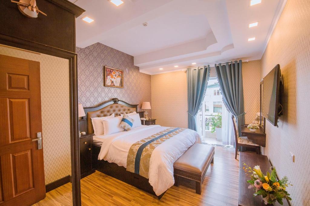Postel nebo postele na pokoji v ubytování Hotel Du Lys