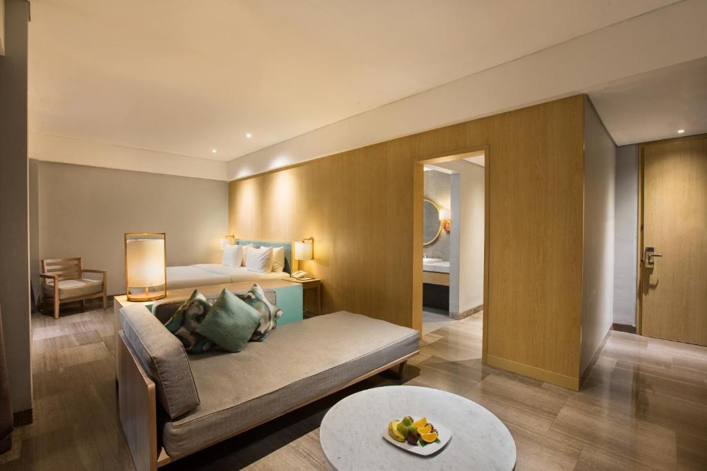 Postel nebo postele na pokoji v ubytování Hotel Santika Premiere Garut