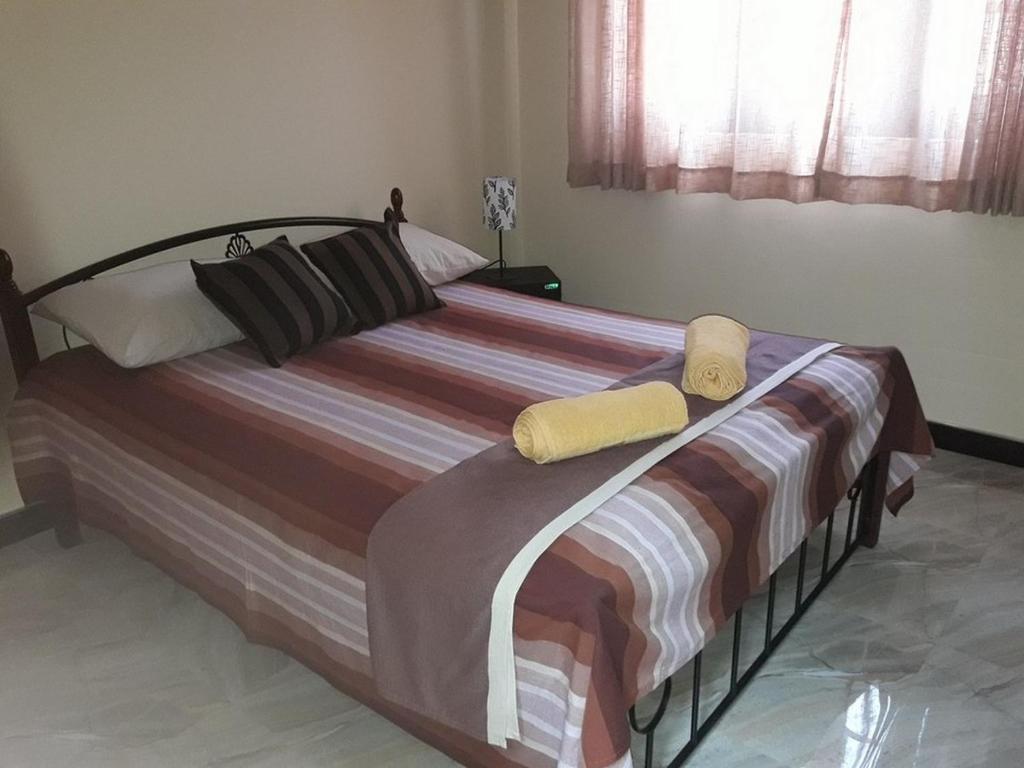 Postel nebo postele na pokoji v ubytování Wattle Inn