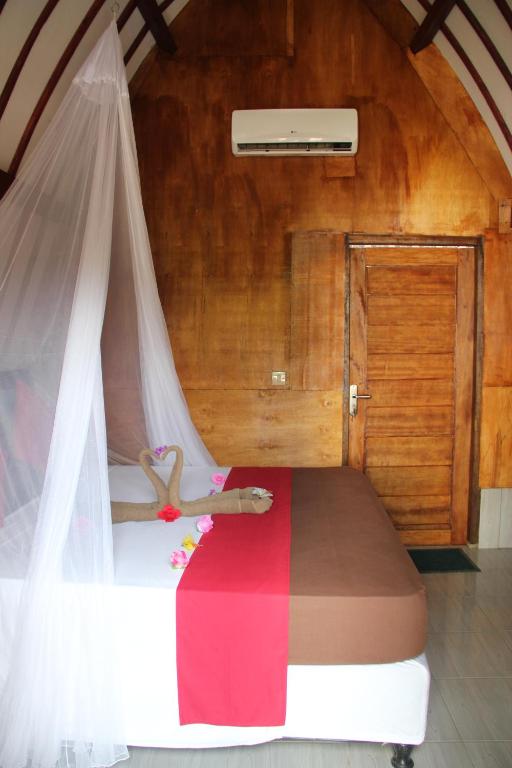 Postel nebo postele na pokoji v ubytování Mirna Homestay
