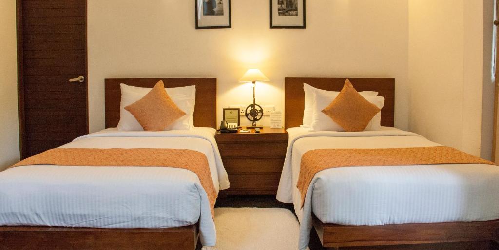 Postel nebo postele na pokoji v ubytování Colombo Court Hotel & Spa