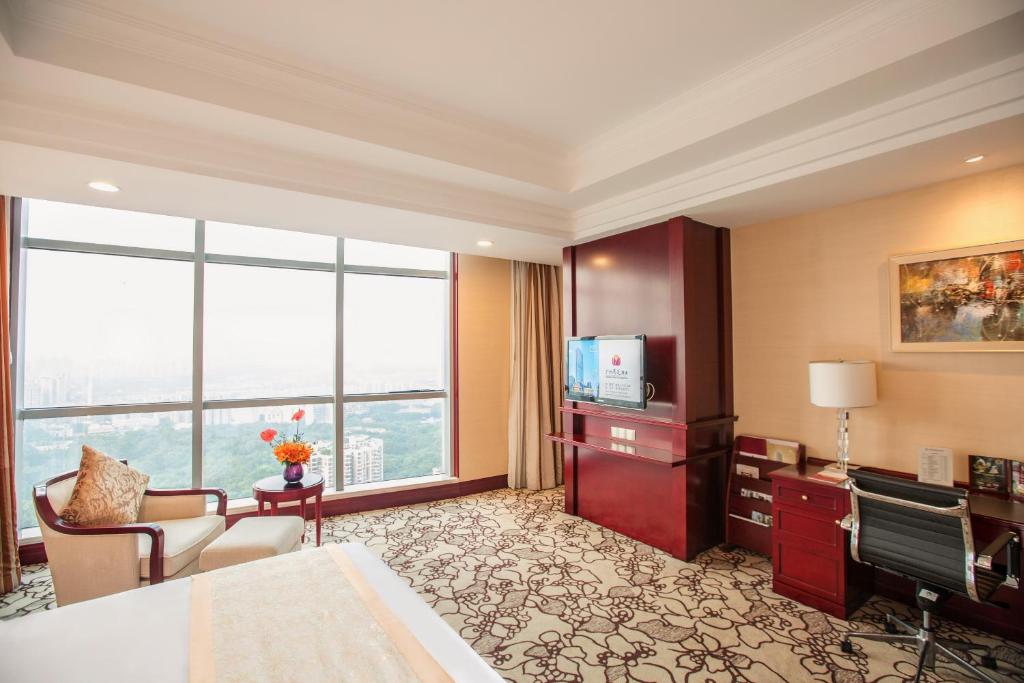 TV a/nebo společenská místnost v ubytování Soluxe Hotel Guangzhou - Overseas Buyers Registration Service&Canton Fair Free Shuttle Bus 15 Oct to 04 Nov