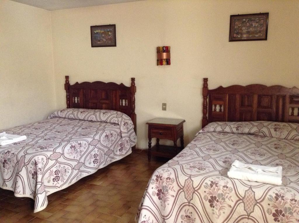 Postel nebo postele na pokoji v ubytování Hotel Atilanos