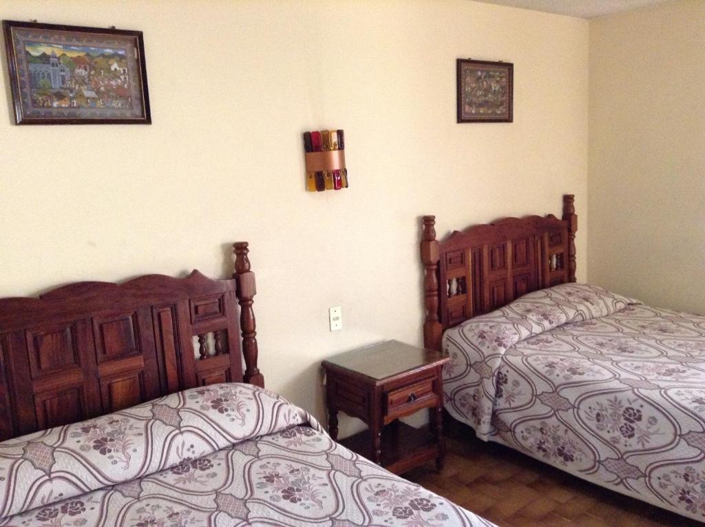 Postel nebo postele na pokoji v ubytování Hotel Atilanos