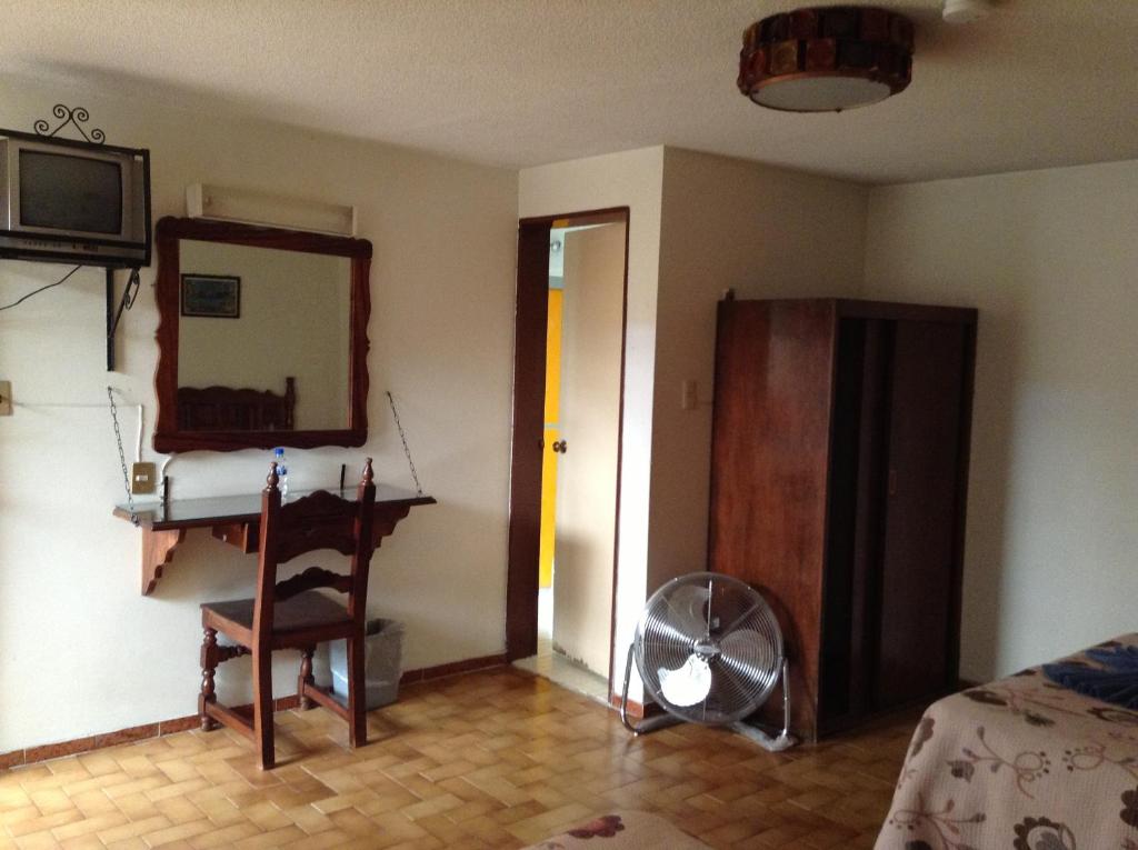 Postel nebo postele na pokoji v ubytování Hotel Atilanos