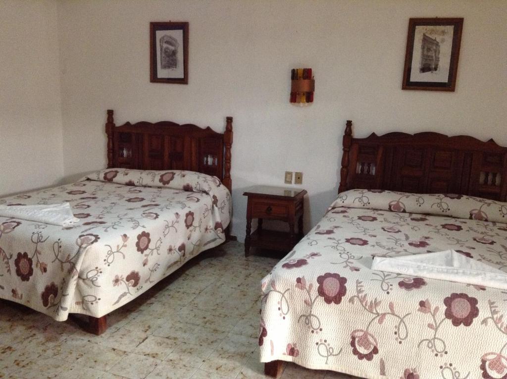 Postel nebo postele na pokoji v ubytování Hotel Atilanos