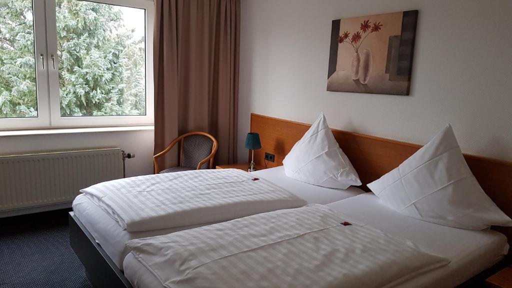 Postel nebo postele na pokoji v ubytování Hotel Walz