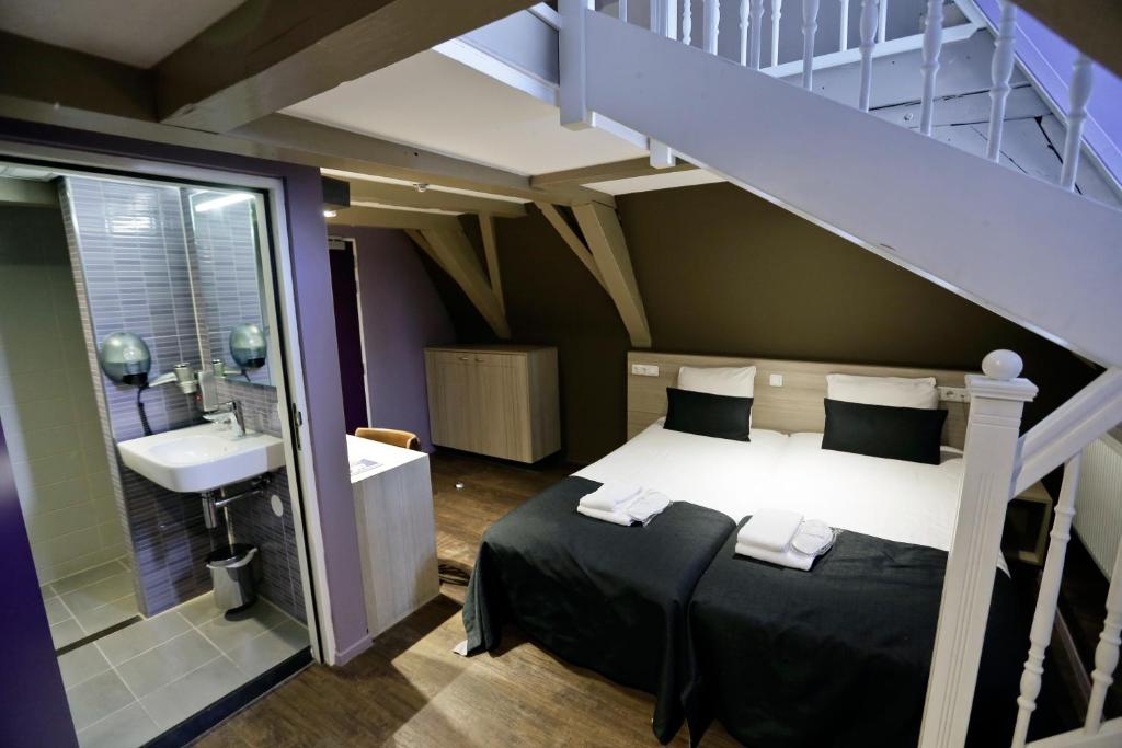 Postel nebo postele na pokoji v ubytování City Hotel Amsterdam