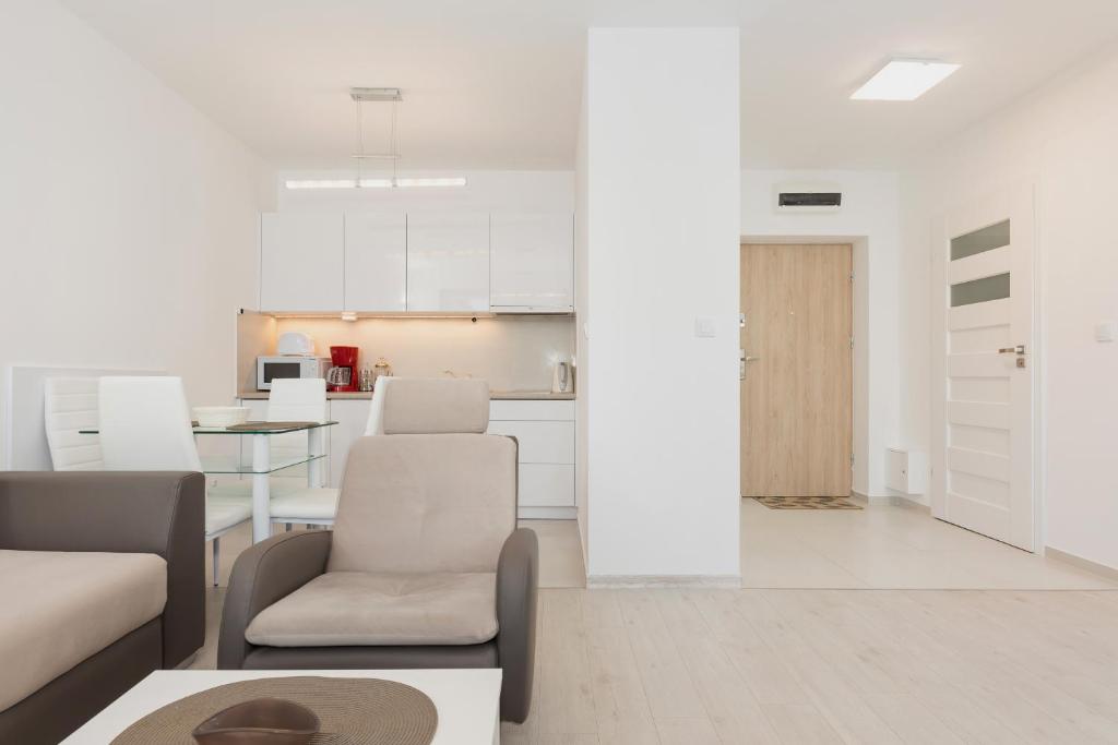 Kuchyň nebo kuchyňský kout v ubytování Wind Rose Quarter Apartments by Noclegi Renters