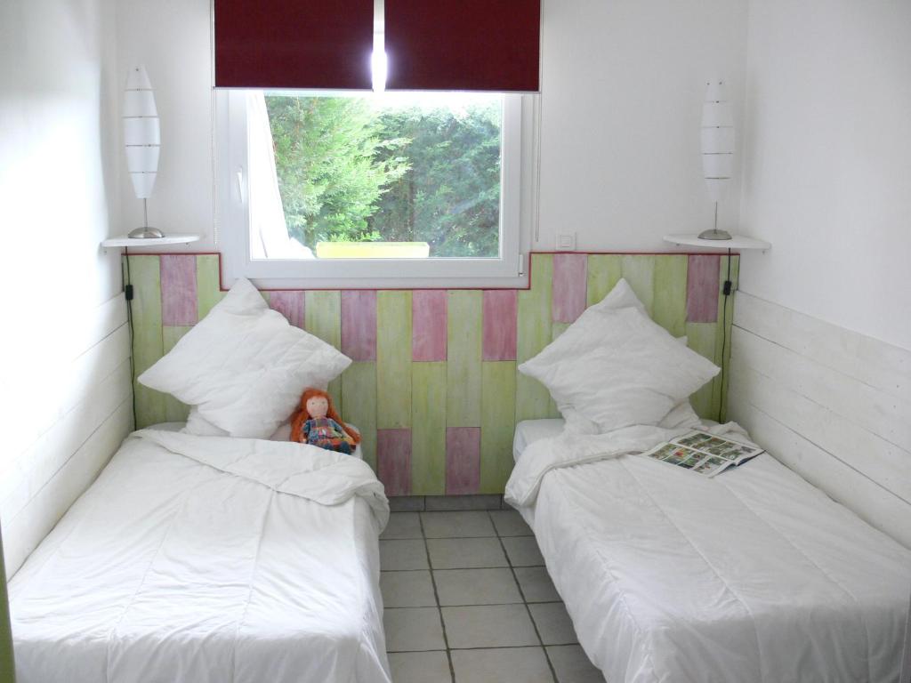 Postel nebo postele na pokoji v ubytování Gîte la Sapinière