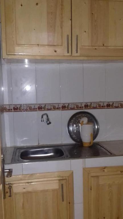 Kuchyň nebo kuchyňský kout v ubytování Hôtel Tijani