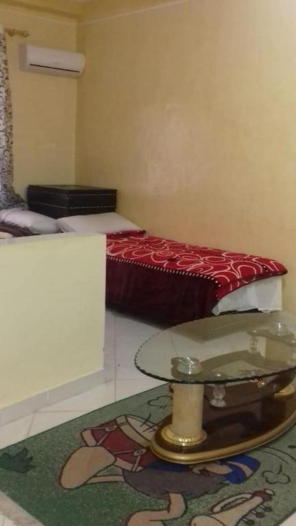 Postel nebo postele na pokoji v ubytování Hôtel Tijani
