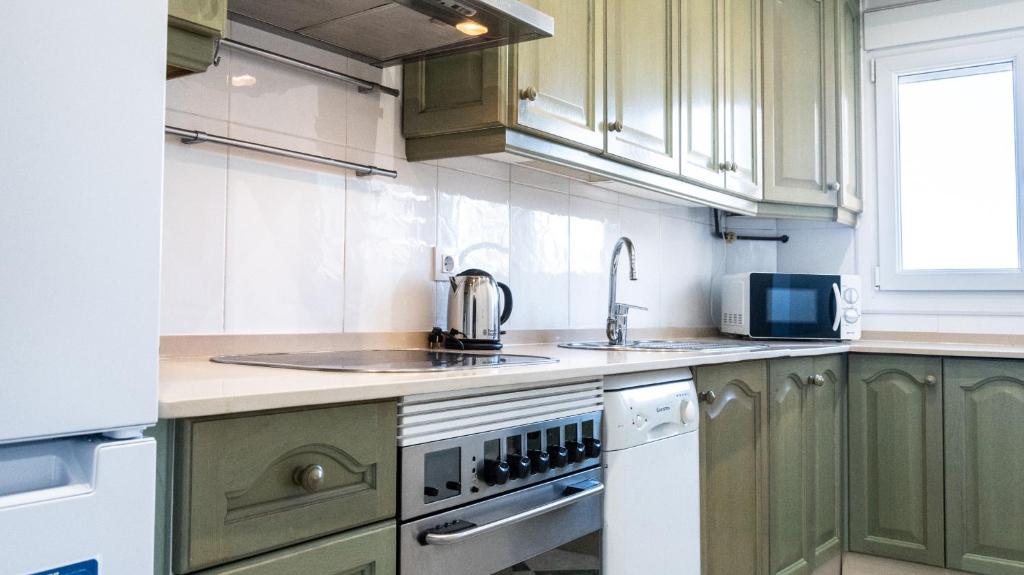 Kuchyň nebo kuchyňský kout v ubytování Apartamento Cadiz Paradiso