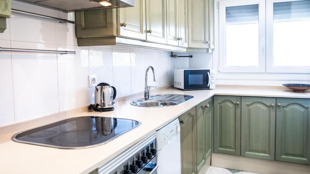 Kuchyň nebo kuchyňský kout v ubytování Apartamento Cadiz Paradiso