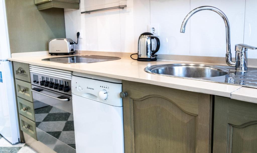 Kuchyň nebo kuchyňský kout v ubytování Apartamento Cadiz Paradiso