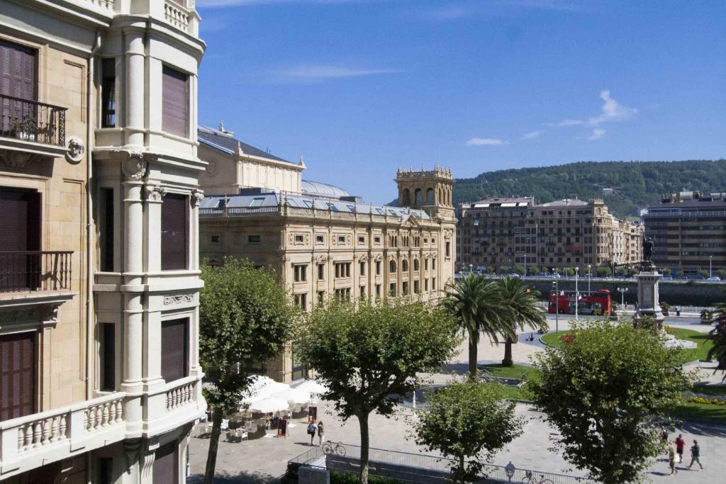 a view of a city with buildings and trees at The Rentals Collection | Okendo I in San Sebastián