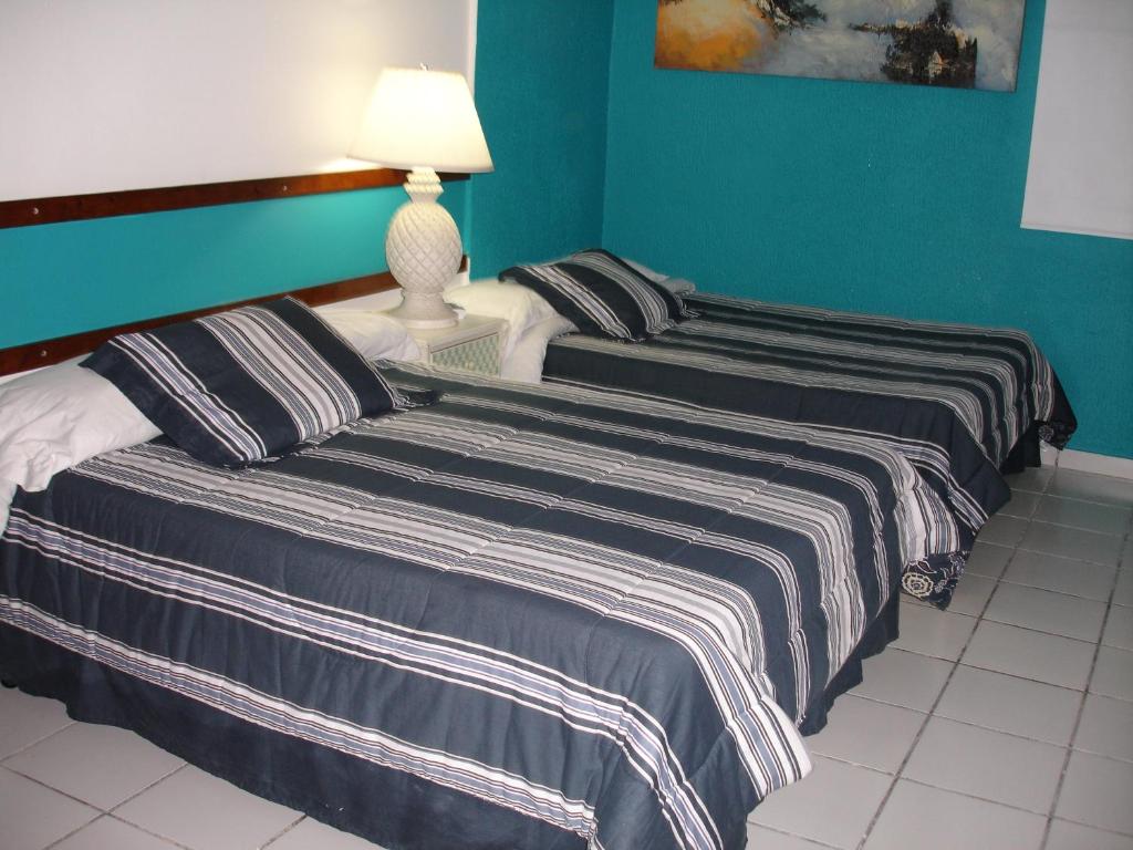 Postel nebo postele na pokoji v ubytování Dreams Hotel Puerto Rico