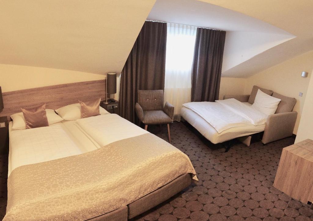 Postel nebo postele na pokoji v ubytování Hotel Sion