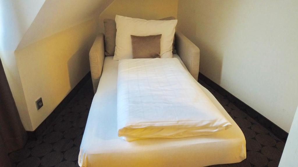 Postel nebo postele na pokoji v ubytování Hotel Sion