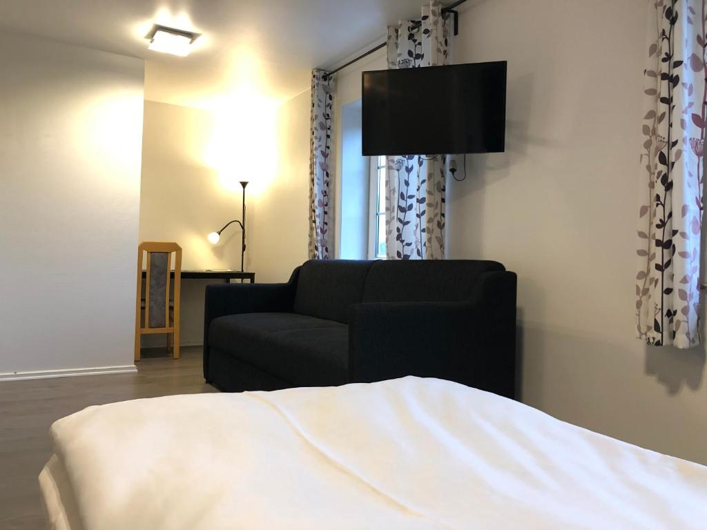 Postel nebo postele na pokoji v ubytování Hotel Aulum Kro