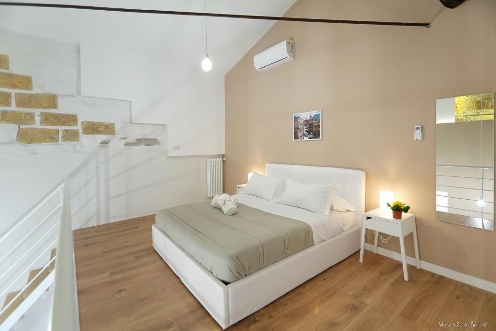 Posteľ alebo postele v izbe v ubytovaní Maison Cutò
