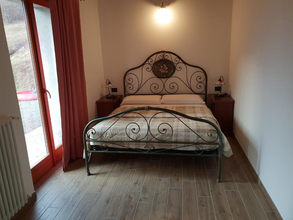 Postel nebo postele na pokoji v ubytování Agriturismo Nona Rosa