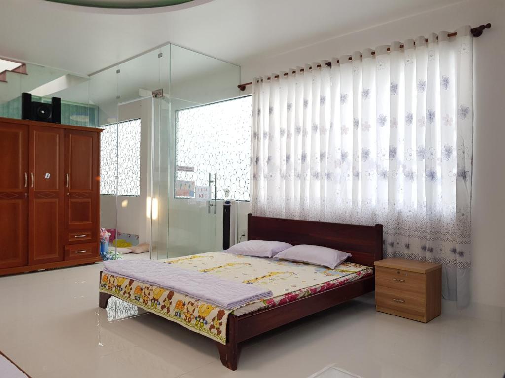 Postel nebo postele na pokoji v ubytování Minh Kim Guesthouse