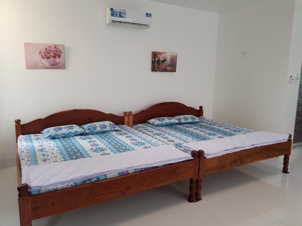 Postel nebo postele na pokoji v ubytování Minh Kim Guesthouse