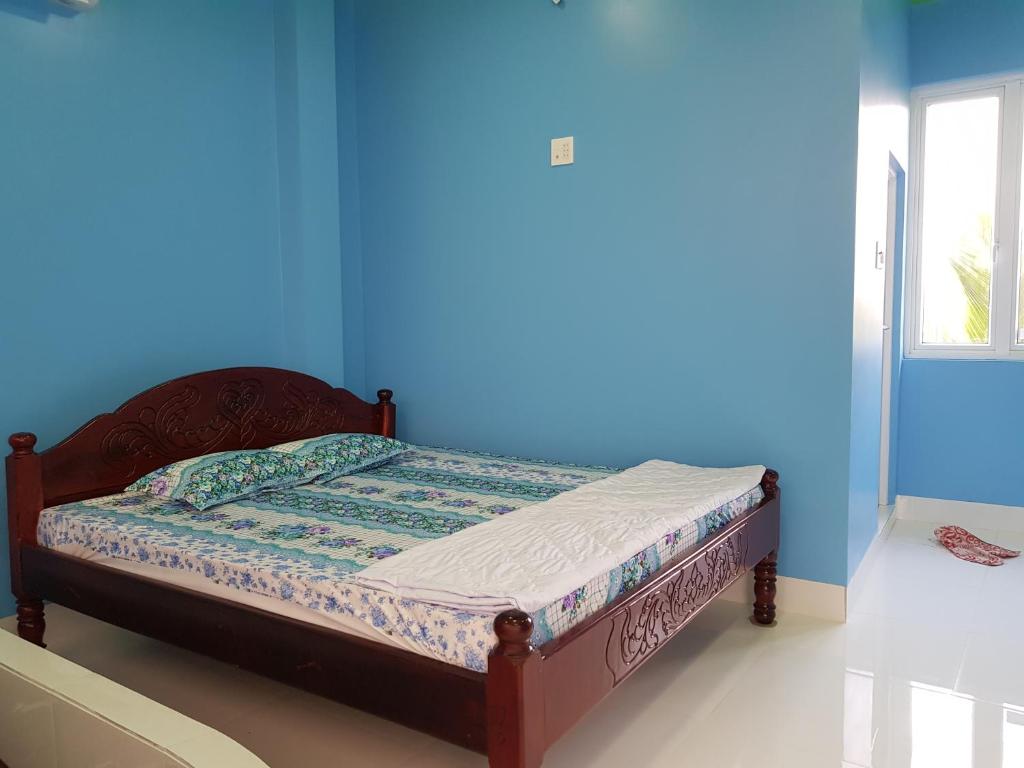 Postel nebo postele na pokoji v ubytování Minh Kim Guesthouse