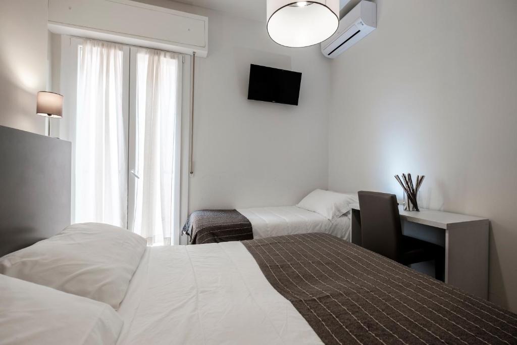 Łóżko lub łóżka w pokoju w obiekcie HOTEL CONDOR