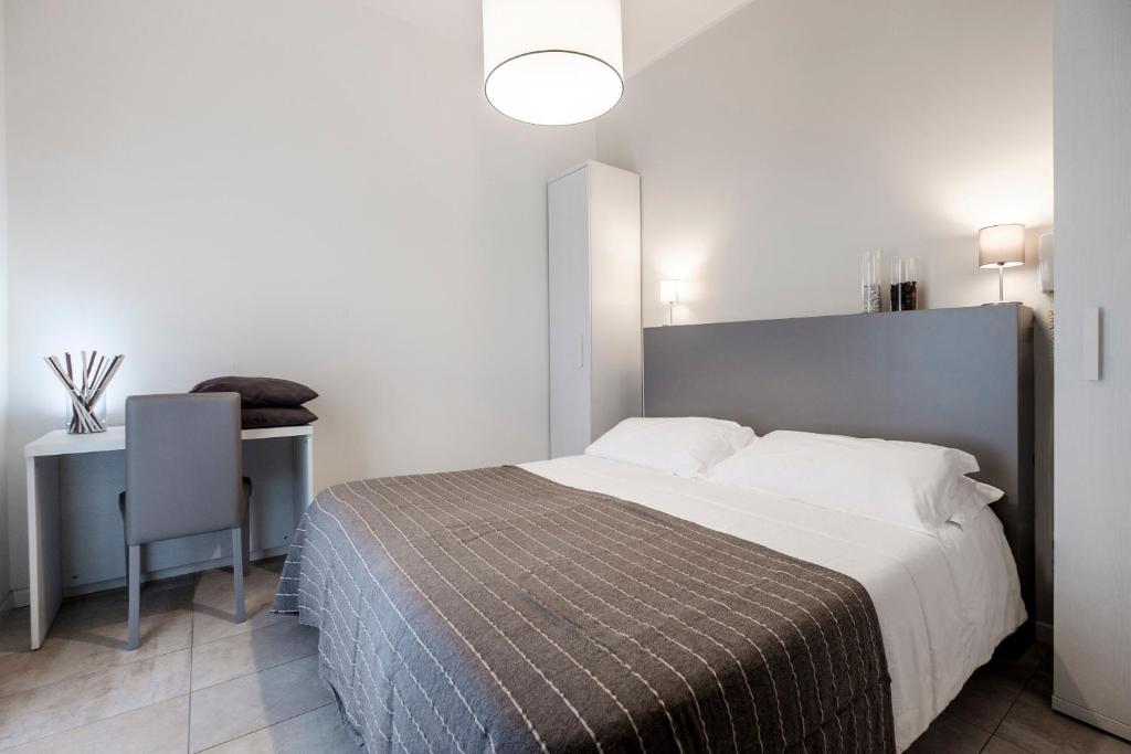 Łóżko lub łóżka w pokoju w obiekcie HOTEL CONDOR