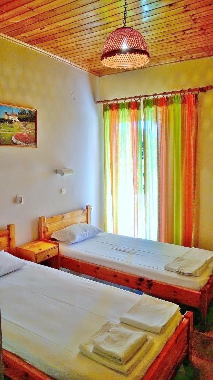 Postel nebo postele na pokoji v ubytování NEFELI House