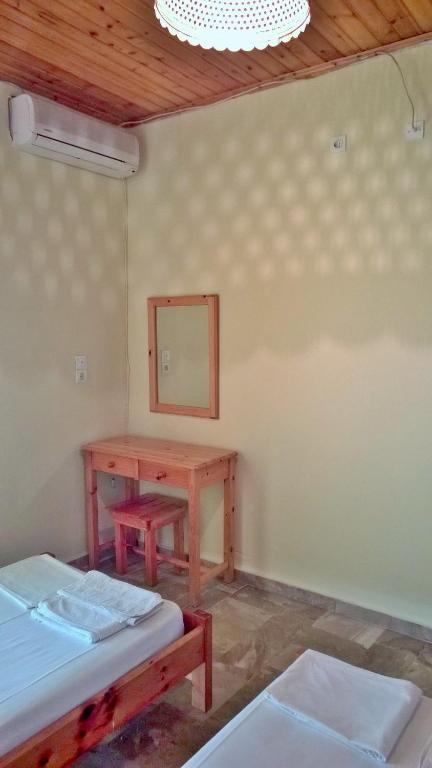 Postel nebo postele na pokoji v ubytování NEFELI House