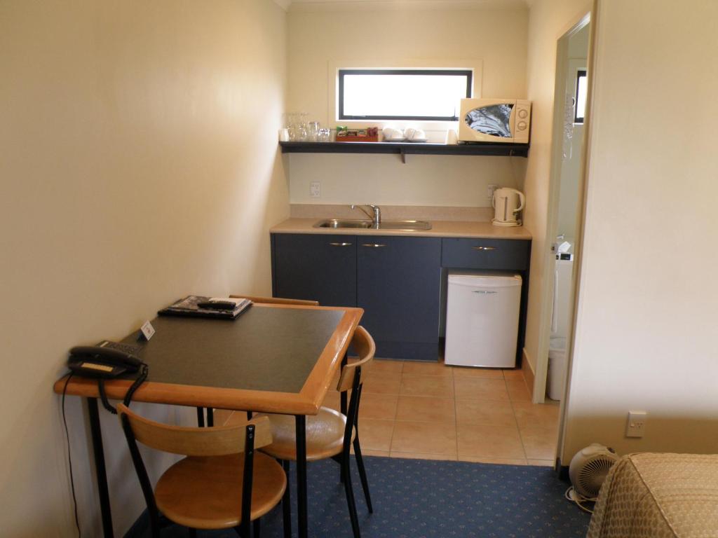 Kuchyň nebo kuchyňský kout v ubytování Stadium Motel