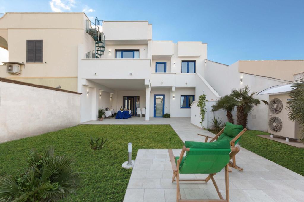 a view of a house with a lawn at B&B Dreams and Delights in Porto Cesareo