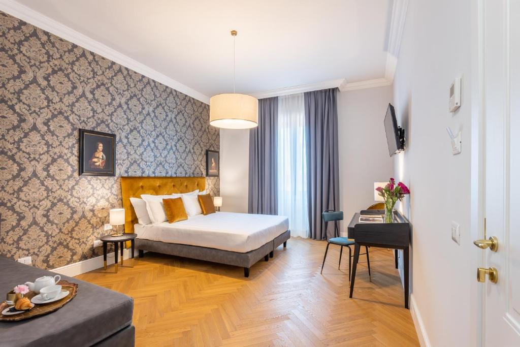 Postel nebo postele na pokoji v ubytování 3110 ArtHotel