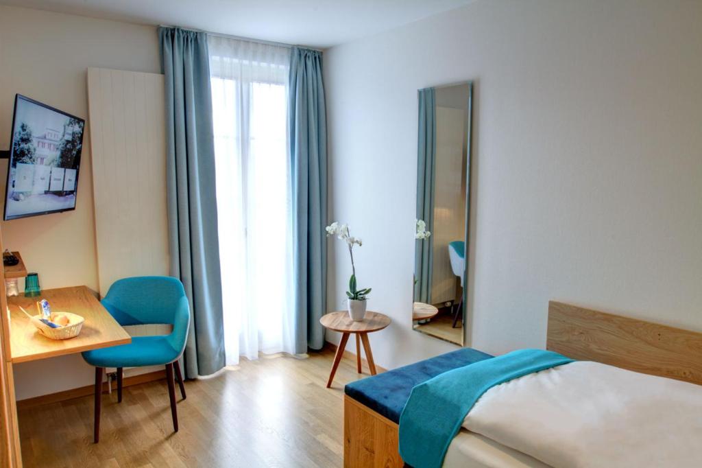 Postel nebo postele na pokoji v ubytování Hotel & Restaurant Hofmatt