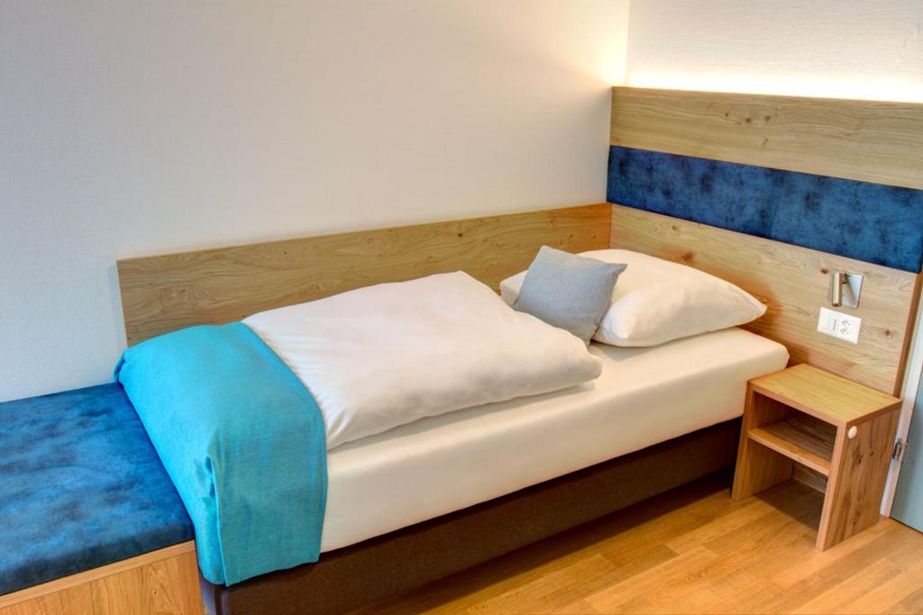 Postel nebo postele na pokoji v ubytování Hotel & Restaurant Hofmatt