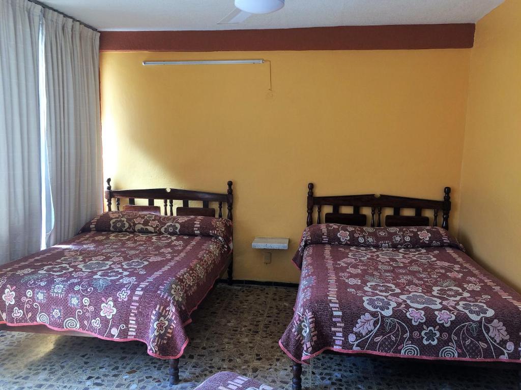 Letto o letti in una camera di Hotel Olimar