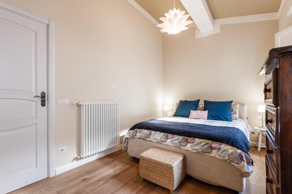 A bed or beds in a room at Affordable suite with a view in the Heart of Lucca