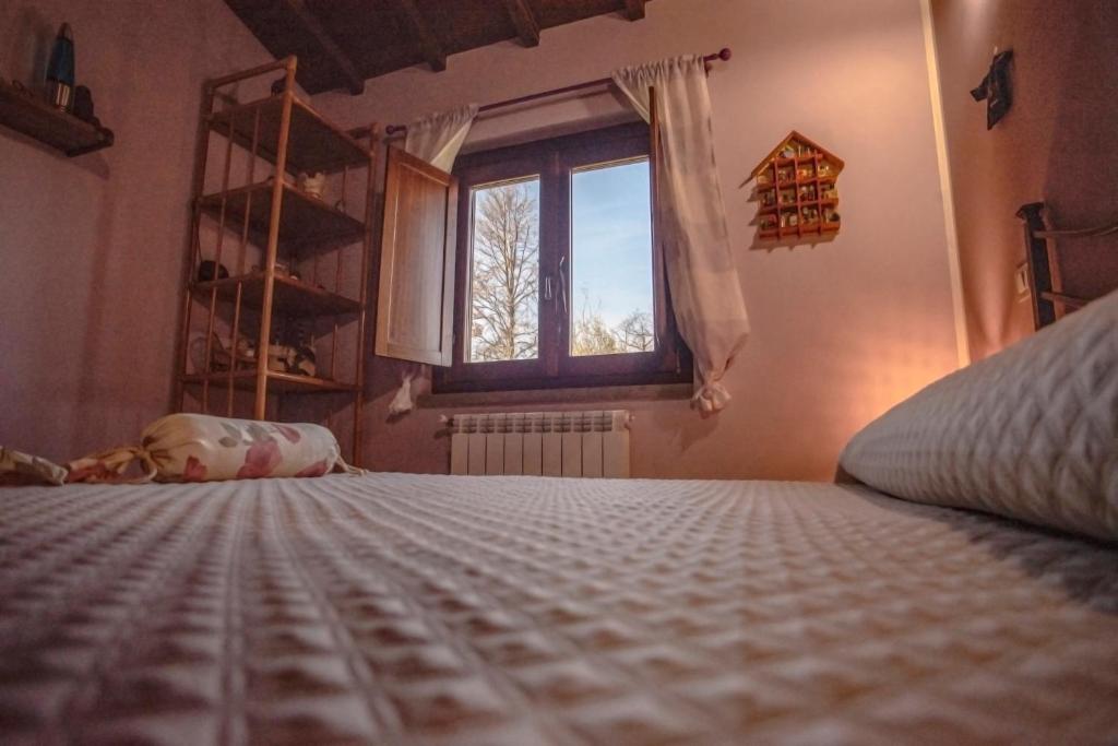 Łóżko lub łóżka w pokoju w obiekcie Villa Farfalla Bianca