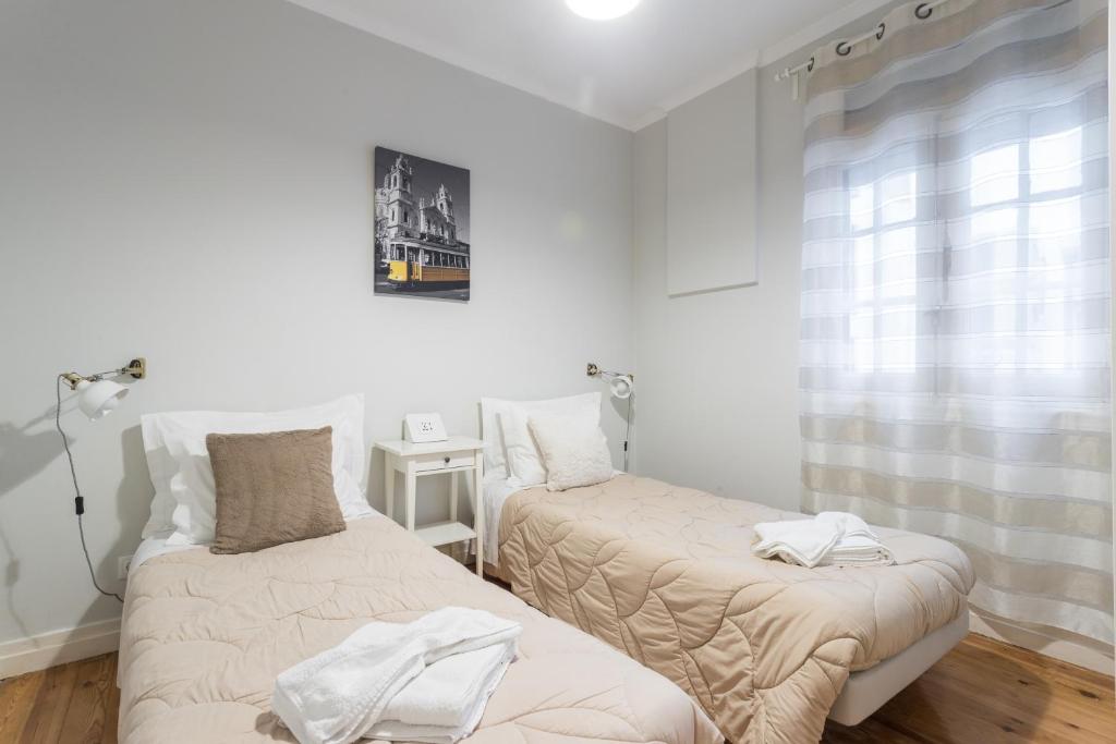 Cama ou camas em um quarto em Lisboa Central Hostel