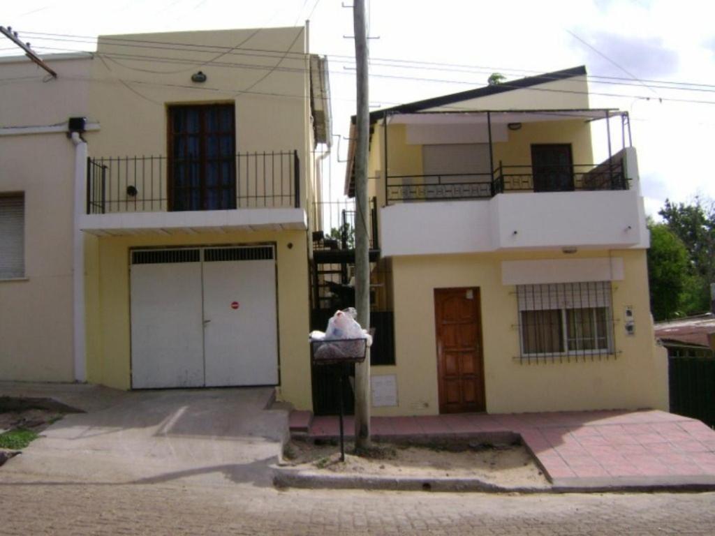 a person standing in front of a house at HUGO 3 in Colón