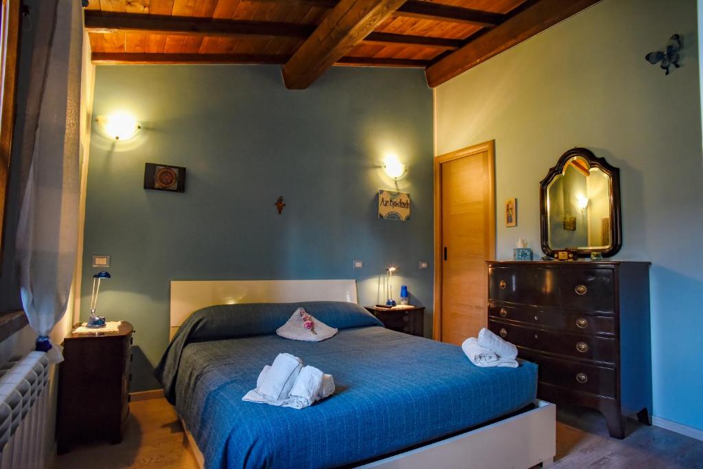 Łóżko lub łóżka w pokoju w obiekcie Villa Farfalla Bianca