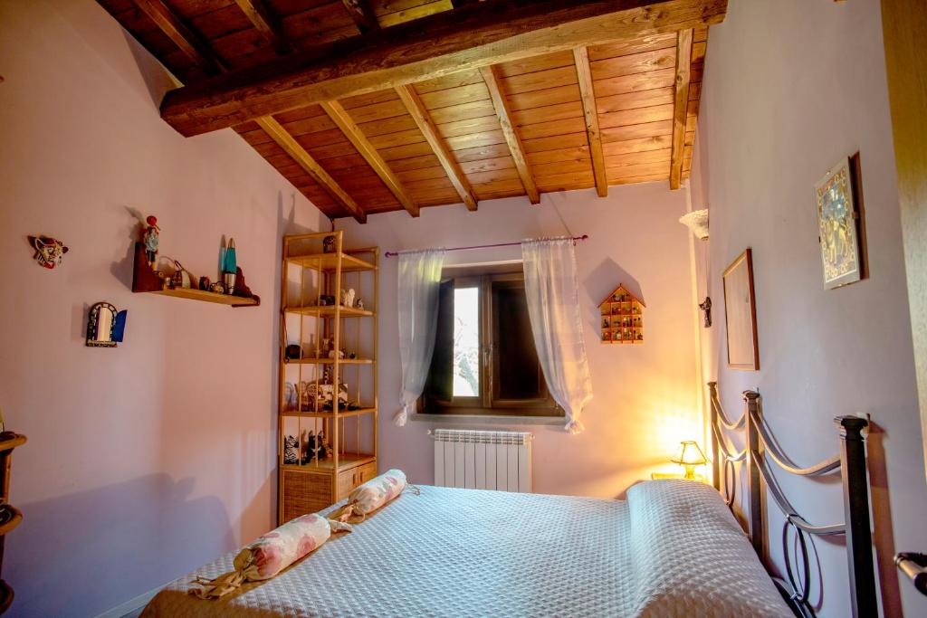 Łóżko lub łóżka w pokoju w obiekcie Villa Farfalla Bianca