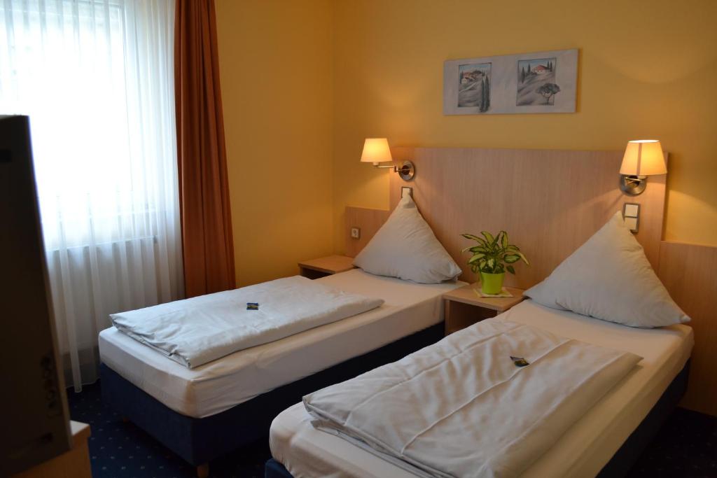 Postel nebo postele na pokoji v ubytování Landgasthof Hock