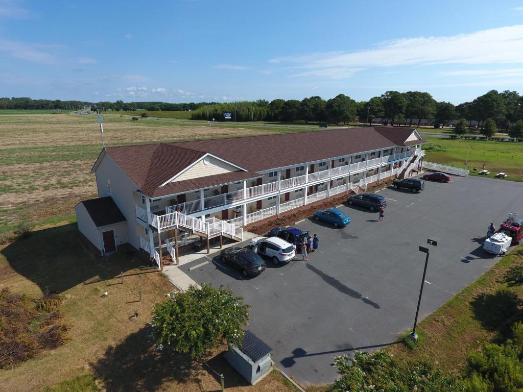 an overhead view of a large building with a parking lot at Shore Stay Suites in Cape Charles